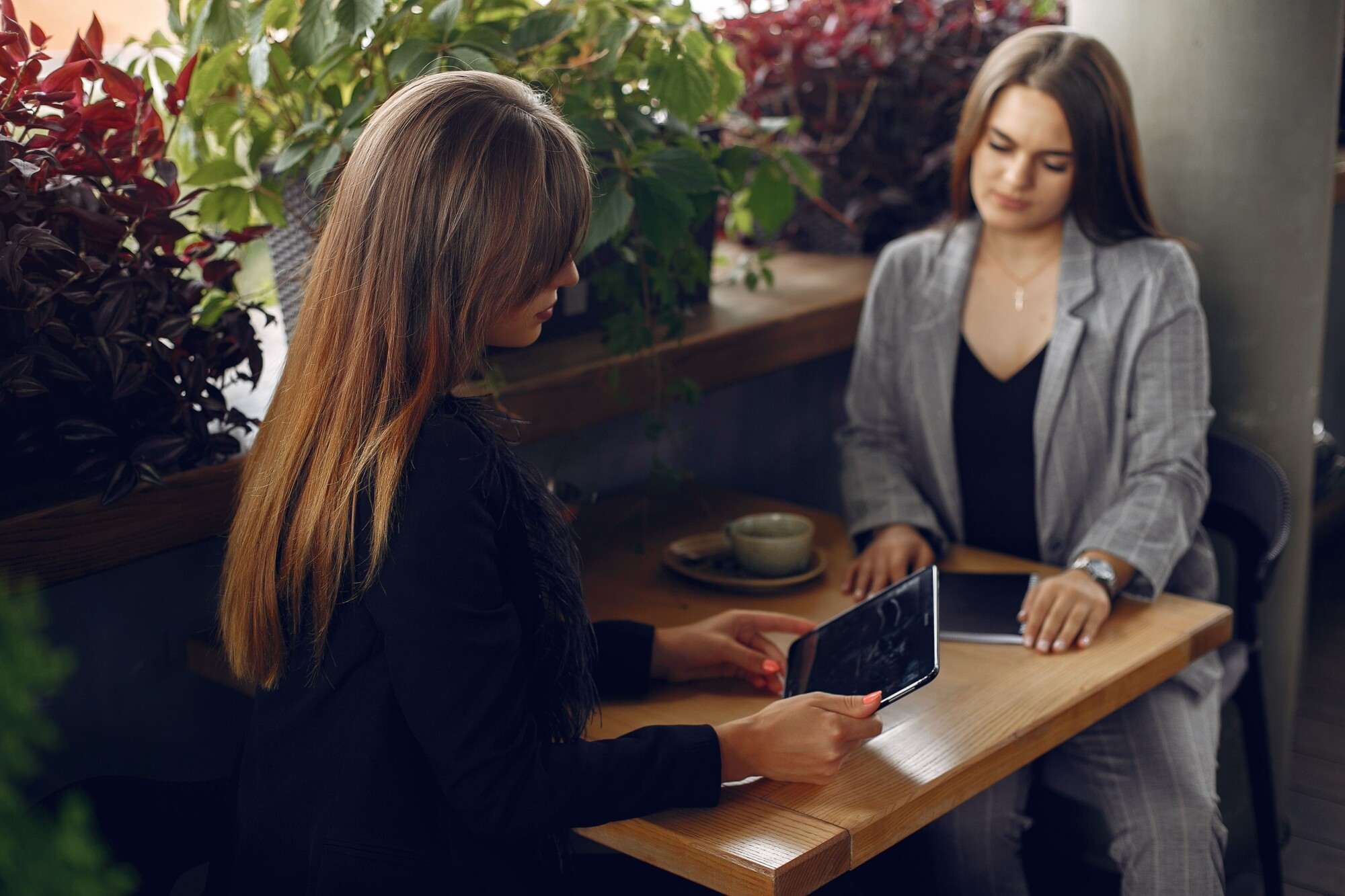 two-businesswomen-working-cafe (1)